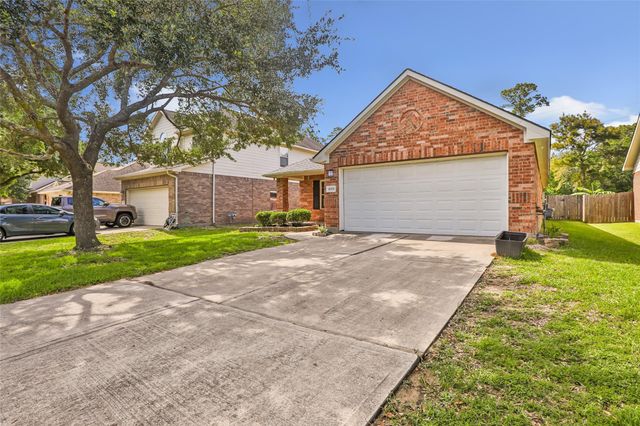 10331 Whisper Bluff Drive, Humble, TX 77396