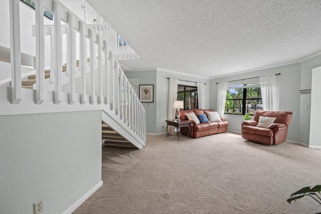 24 Uno Lago Drive, Juno Beach, FL 33408