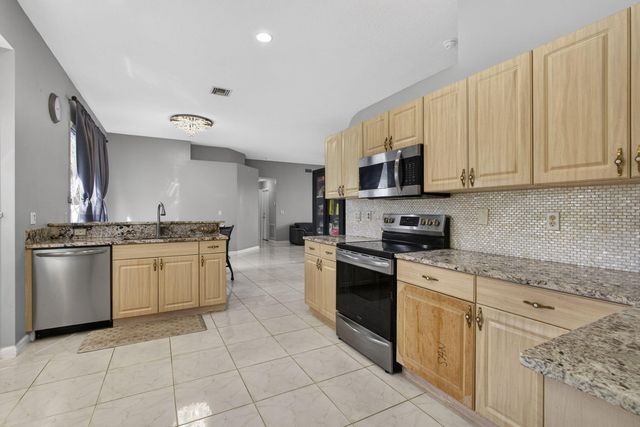 102 Brook Woode Court, Royal Palm Beach, FL 33411