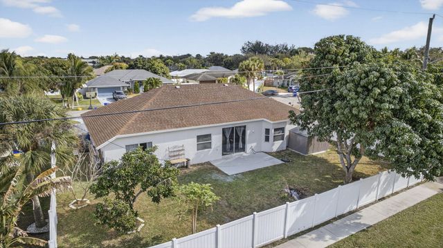 102 Brook Woode Court, Royal Palm Beach, FL 33411