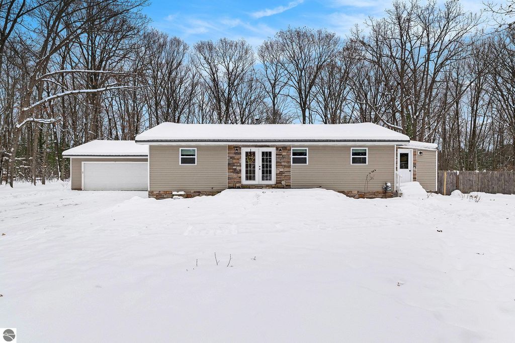 Image 1 of property listing at 1821 Rogers Road, Grawn, MI 49637