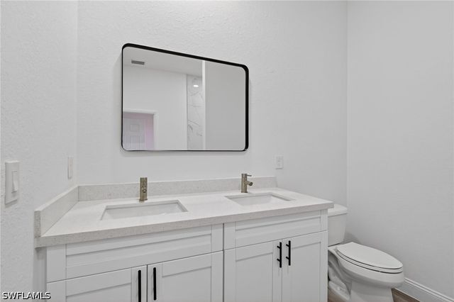 560 Genoa AVE S, Lehigh Acres, FL 33974