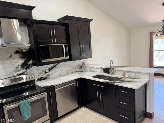 702 Calvin AVE, Lehigh Acres, FL 33972
