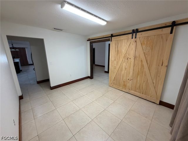 702 Calvin AVE, Lehigh Acres, FL 33972