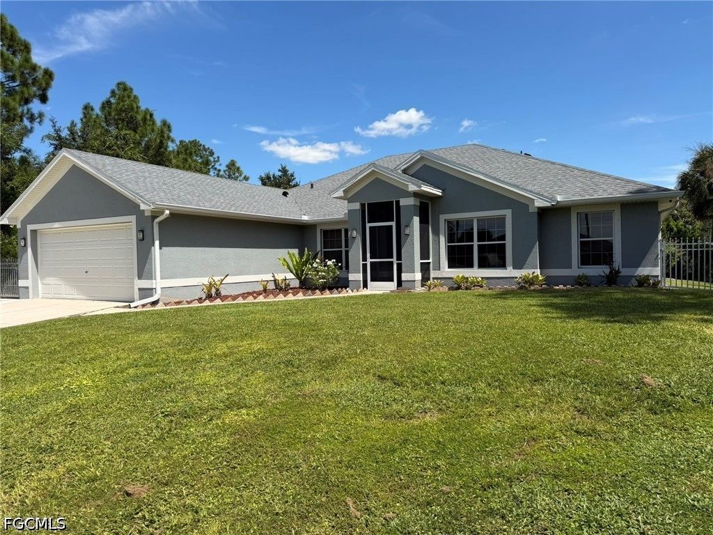 702 Calvin AVE, Lehigh Acres, FL 33972