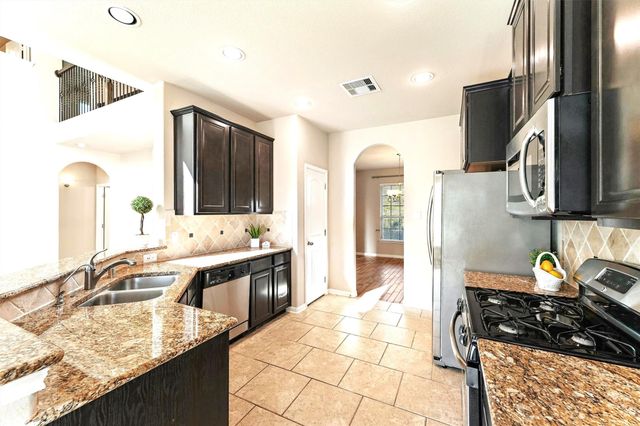 91 W Wading Pond Circle, The Woodlands, TX 77375