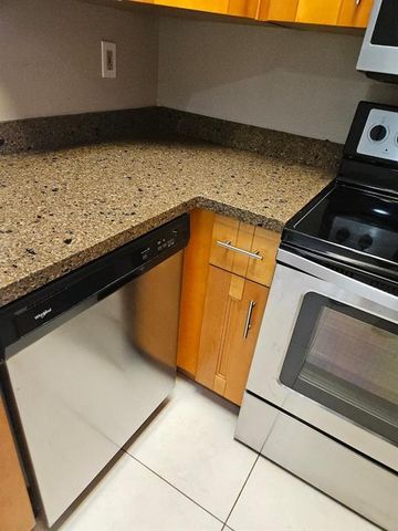 741 LYONS Road 17203, Coconut Creek, FL 33063