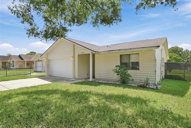 7720 LAKESIDE WOODS DRIVE, Orlando, FL 32810