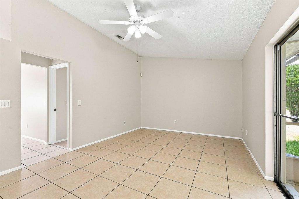 Image 2 of property listing at 7720 LAKESIDE WOODS DRIVE, Orlando, FL 32810