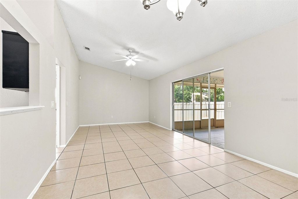 Image 3 of property listing at 7720 LAKESIDE WOODS DRIVE, Orlando, FL 32810