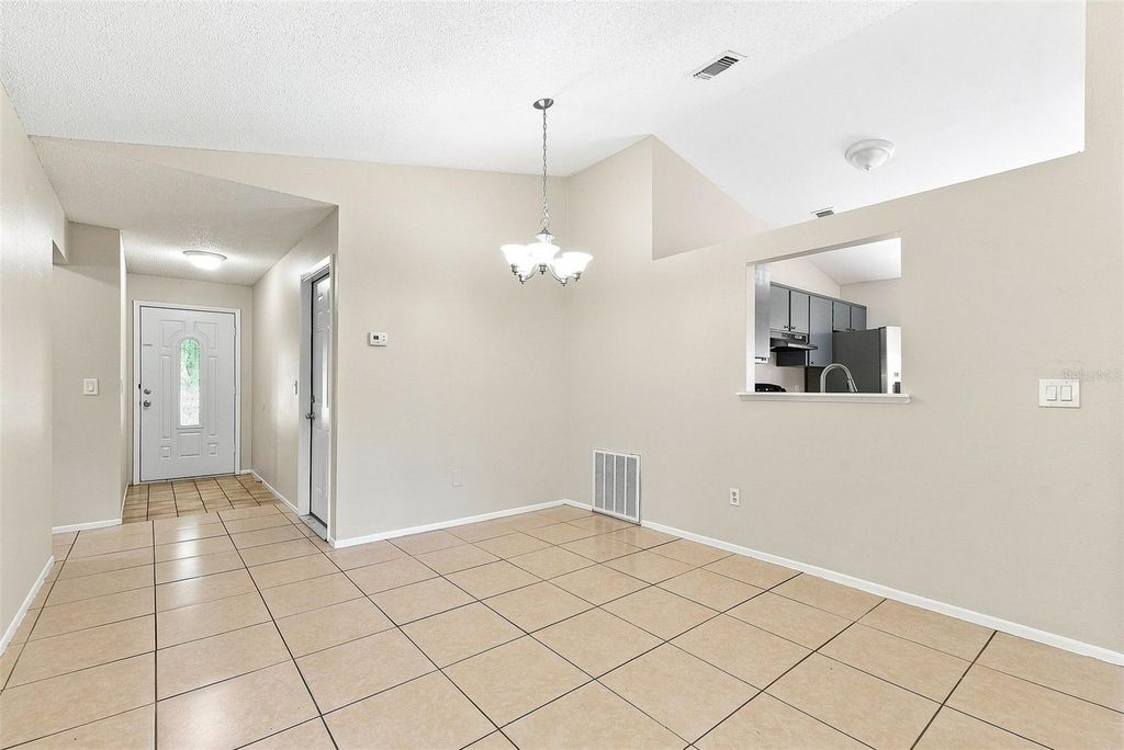 Image 5 of property listing at 7720 LAKESIDE WOODS DRIVE, Orlando, FL 32810