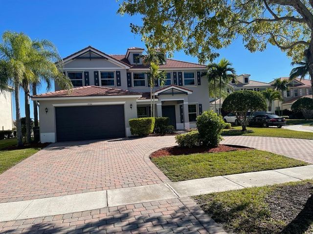 9326 Plantation Estates Dr, Royal Palm Beach, FL 33411