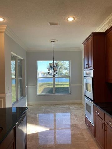 9326 Plantation Estates Dr, Royal Palm Beach, FL 33411