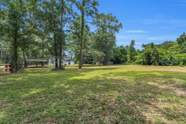 33102 Rollingwood Drive, Pinehurst, TX 77362