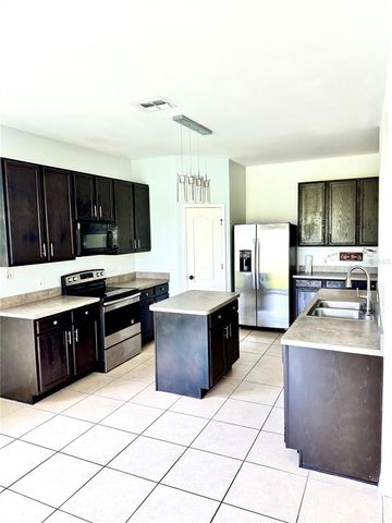 1944 THE OAKS BOULEVARD, Kissimmee, FL 34746