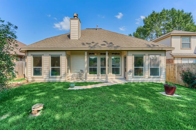 7090 Gentle Breeze Drive, Willis, TX 77318
