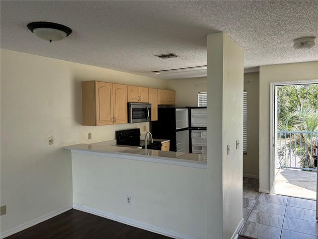 2556 WOODGATE BOULEVARD 203, Orlando, FL 32822