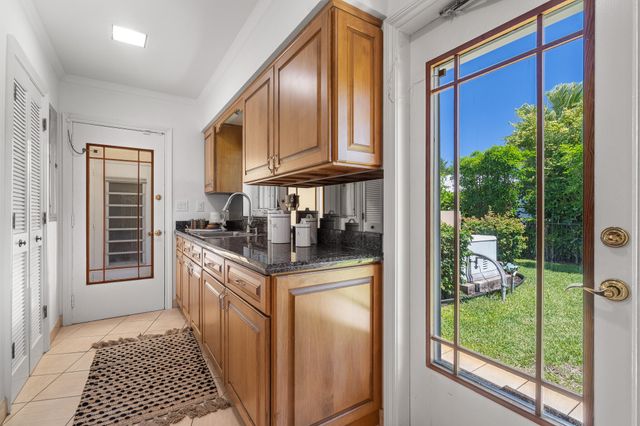 57 Cayuga Road, Sea Ranch Lakes, FL 33308
