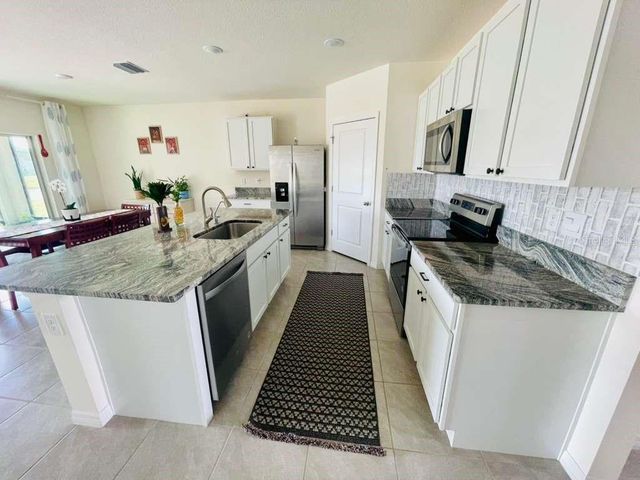 8954 FORGE BREEZE LOOP, Wesley Chapel, FL 33545