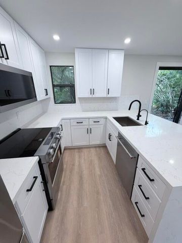7094 Rain Forest Drive H-7-l, Boca Raton, FL 33434