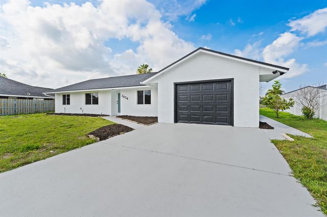 2674 SW Monterrey Lane, Port St. Lucie, FL 34953