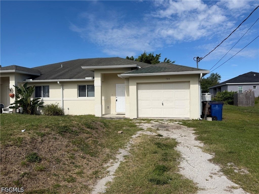 704 Gilbert AVE S, Lehigh Acres, FL 33973