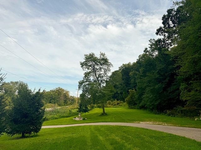 8824 Grand River Drive SE, Ada, MI 49301