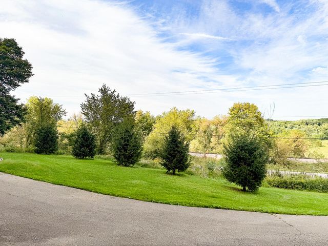 8824 Grand River Drive SE, Ada, MI 49301