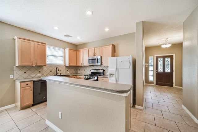 12855 Whistling Springs Drive, Humble, TX 77346