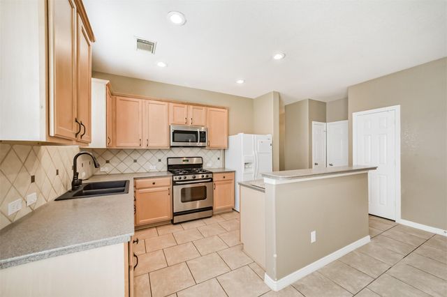 12855 Whistling Springs Drive, Humble, TX 77346