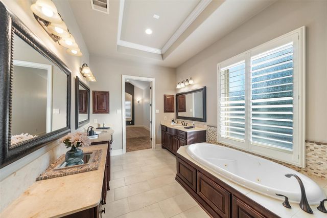 1002 Highclere Holly Court, Conroe, TX 77384