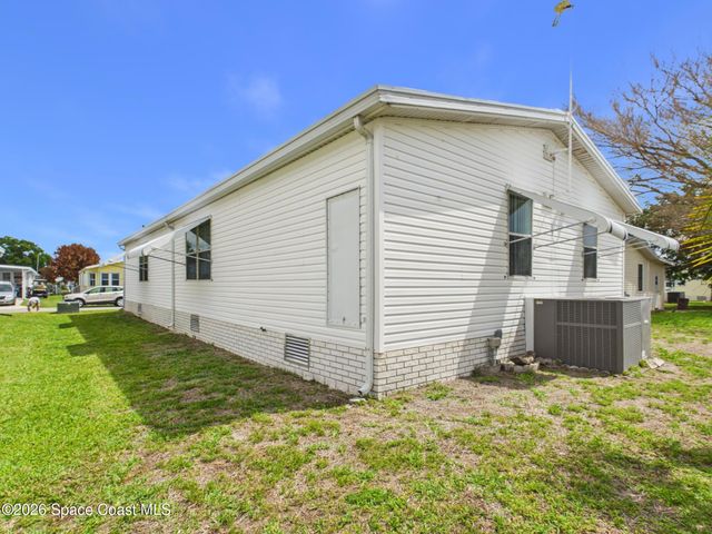 573 Dolphin Circle, Barefoot Bay, FL 32976