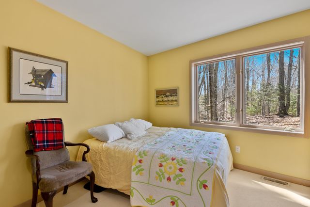 1995 San Marino Trail, Kewadin, MI 49648