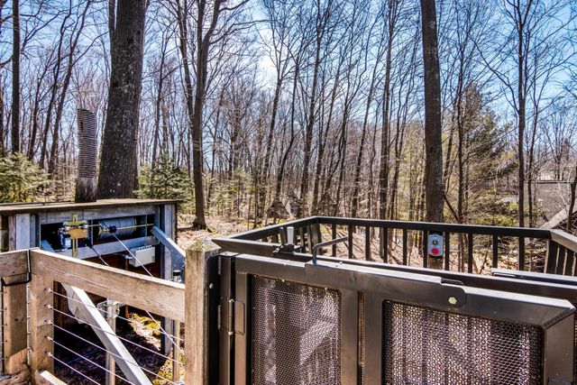 1995 San Marino Trail, Kewadin, MI 49648