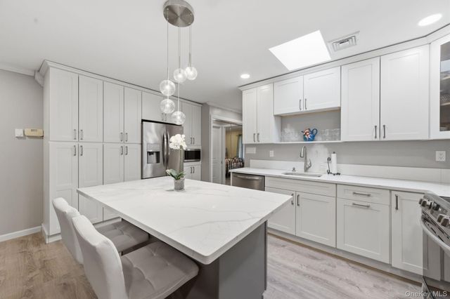 200 NewCastle Court E, Ridge, NY 11961