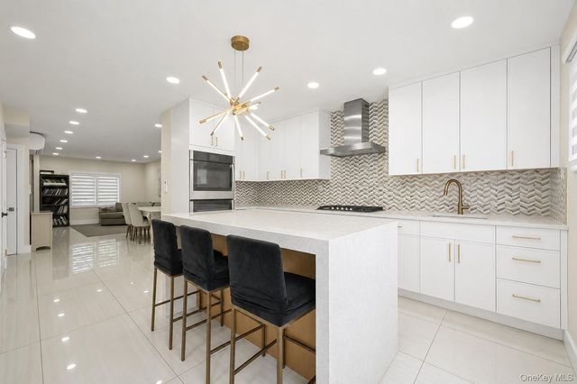 76-37 Vleigh Place, Kew Garden Hills, NY 11367