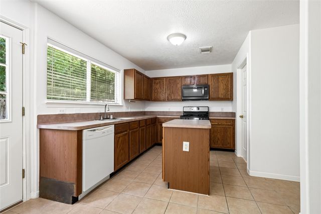 5019 Woodland Meadows Lane, Humble, TX 77346