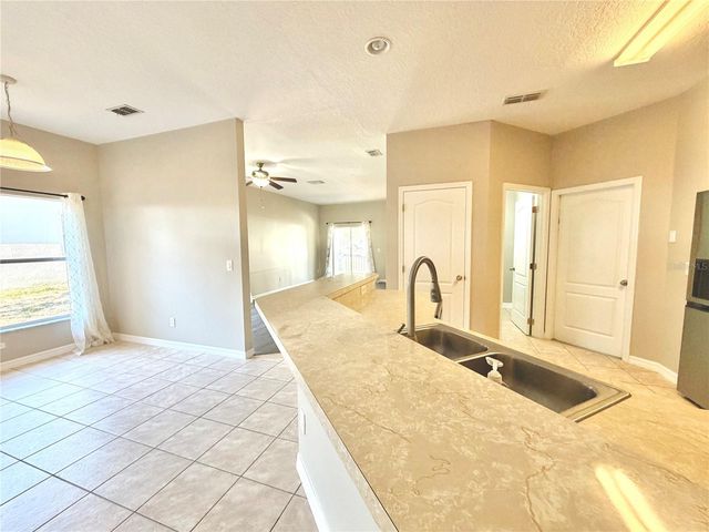 1044 LONGVILLE CIRCLE, Tavares, FL 32778