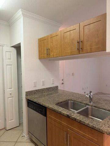 6505 EMERALD DUNES Drive 107, West Palm Beach, FL 33411