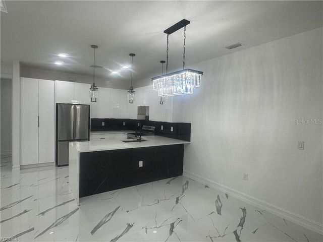 518 HARRY THAYER AVENUE S, Lehigh Acres, FL 33974