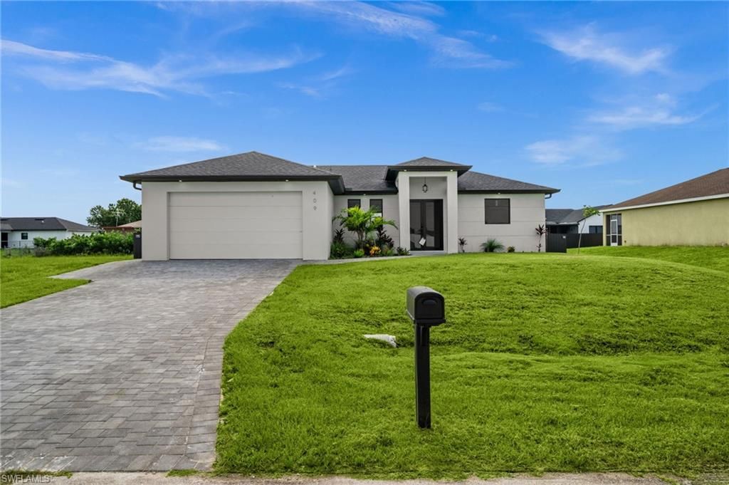 Image 1 of property listing at 409 25TH PL, Cape Coral, FL 33993