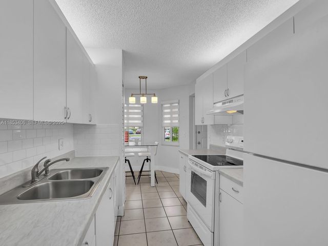 13001 SW 15th Court 104T, Pembroke Pines, FL 33027