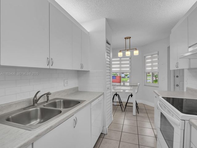 13001 SW 15th Court 104T, Pembroke Pines, FL 33027