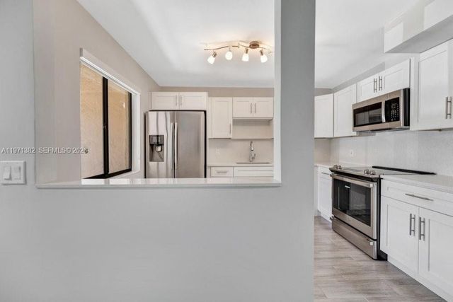 380 Racquet Club Rd 105, Weston, FL 33326