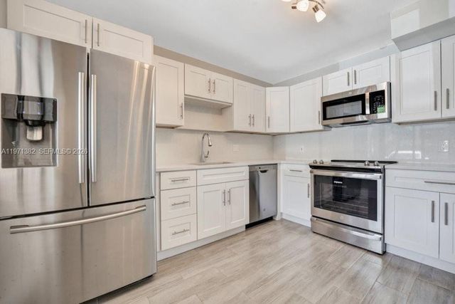 380 Racquet Club Rd 105, Weston, FL 33326