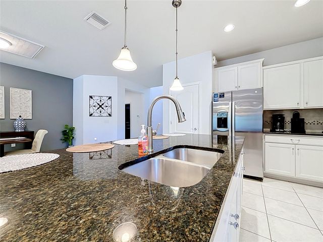 8879 QIN LOOP, Kissimmee, FL 34747