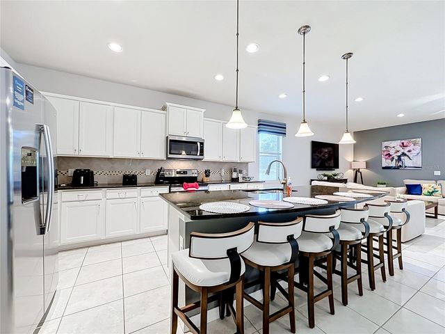8879 QIN LOOP, Kissimmee, FL 34747