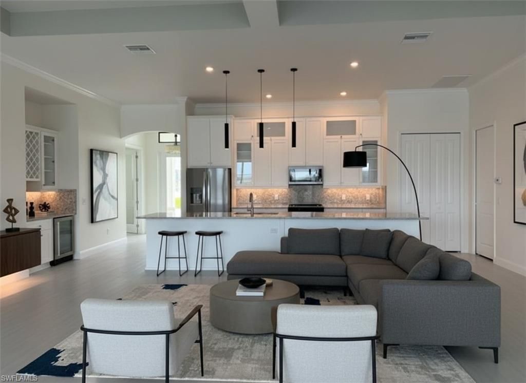 Image 4 of property listing at 136 NW 29th PL, Cape Coral, FL 33993
