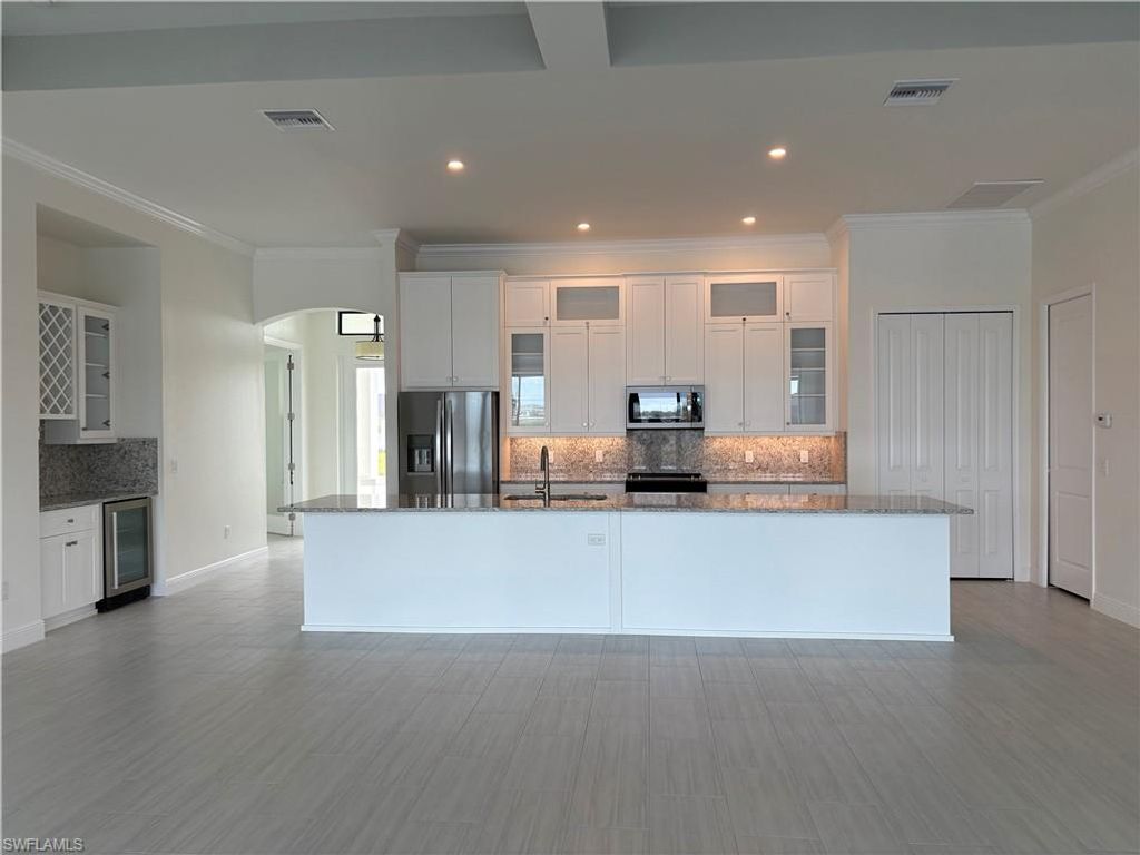 Image 5 of property listing at 136 NW 29th PL, Cape Coral, FL 33993