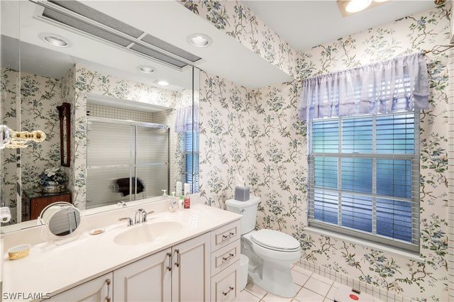 712 Pine Creek LN, Naples, FL 34108